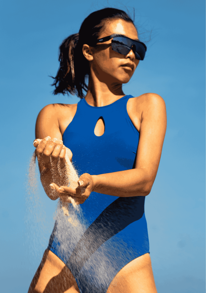 A woman snorkeling in tropical waters with a Leda Sport one-piece that provides effective sun protection and durable fabric resistant to coral abrasion.