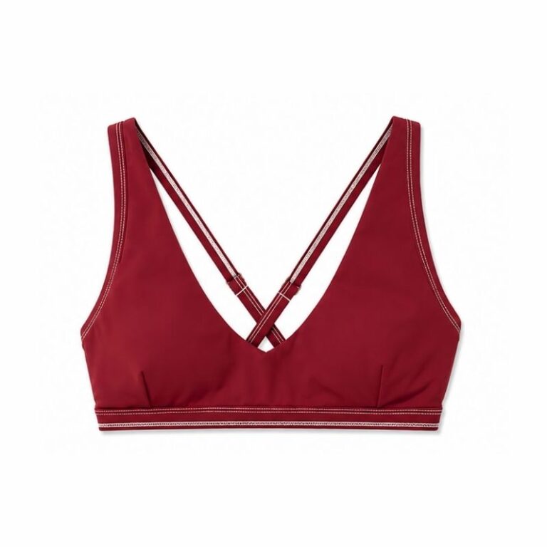 Flat lay of the syrah red Cala U-neck swim top with cross-back straps and light contrast stitching
