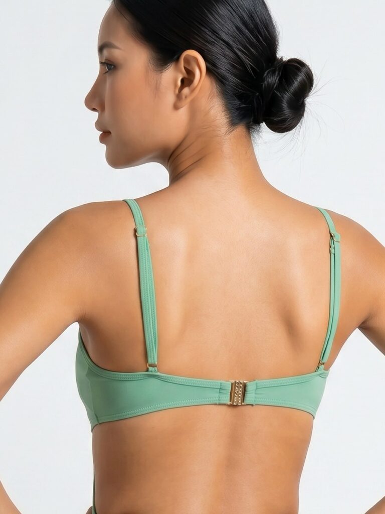 Close-up of the metal back clasp on the matcha green Viva one-piece