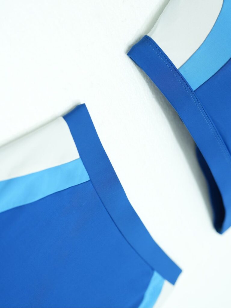 Flat lay detail of the royal blue Zeta brief showing the double-layer binding