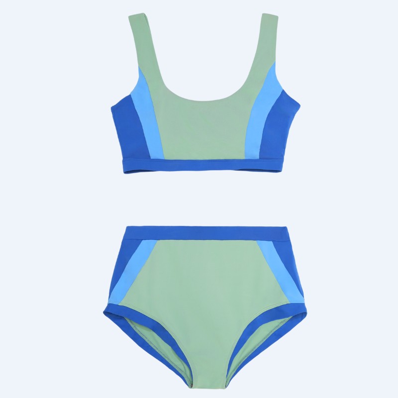 Flat lay of the Zeta color-block two-piece swimsuit in matcha green