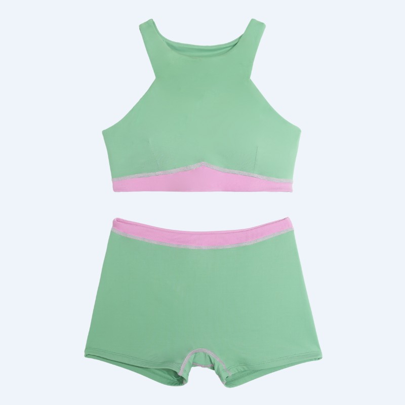 Flat lay of the Tenacy color-block two-piece swimsuit in matcha green