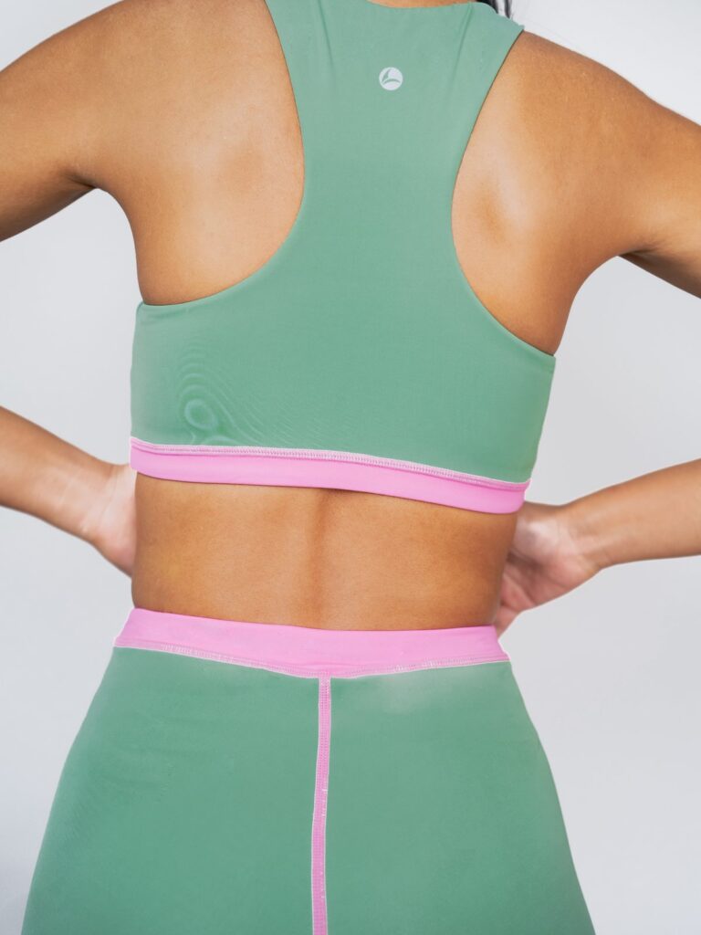 Back view of the Tenacy racerback top and the shorts' pink seat line