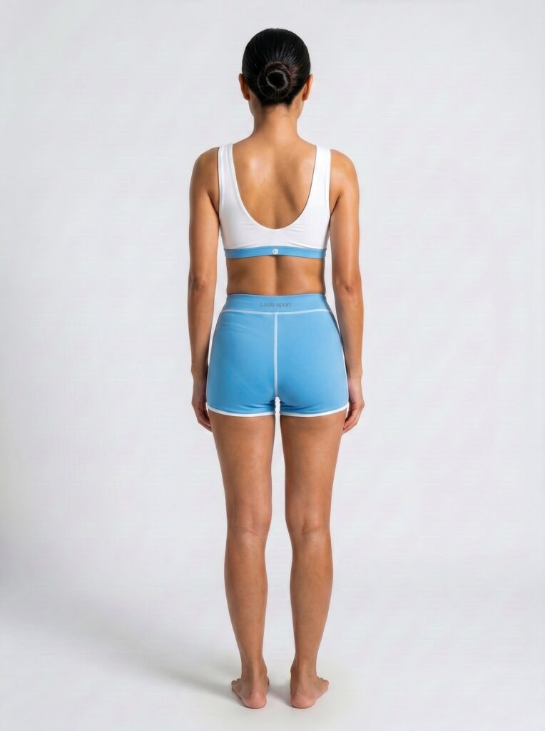 Back view of the cornflower blue Cala high-waist boyshort with a white swim top