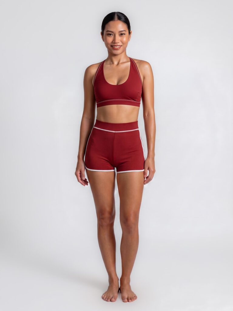Studio front view of the syrah red Cala U-neck swim top and high-waist boyshort with light contrast binding
