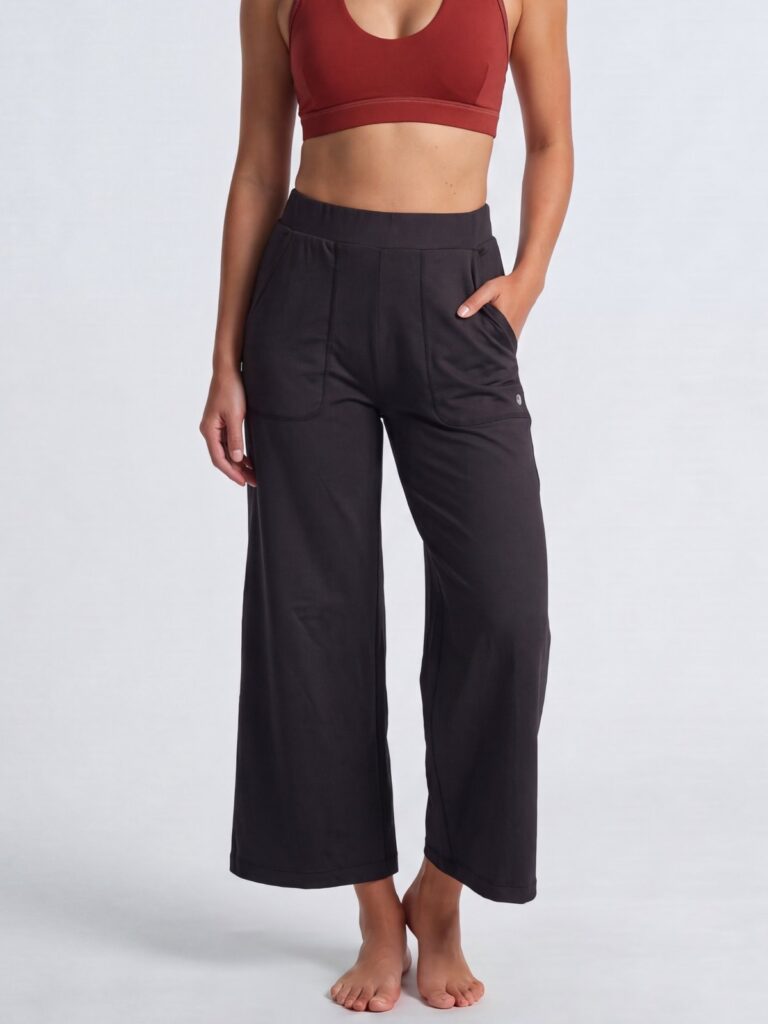 Studio front close-up of the black wide-leg cropped pull-on pants with front pockets