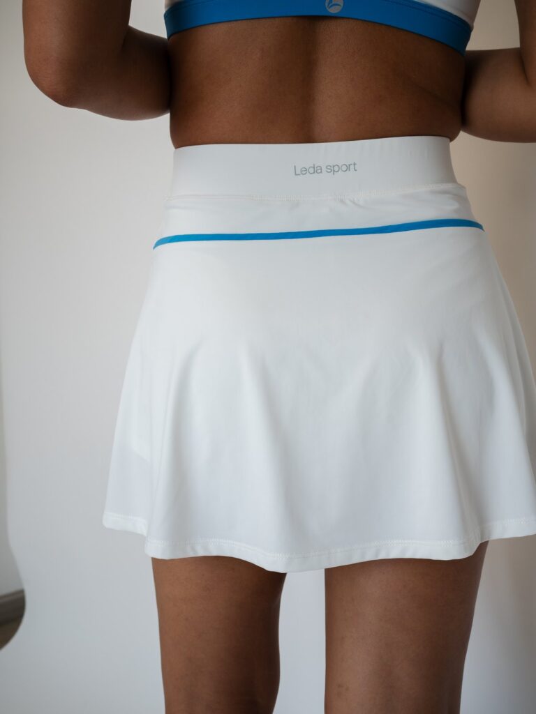 Back view of the cream white Siena skort with a blue line along the waistband