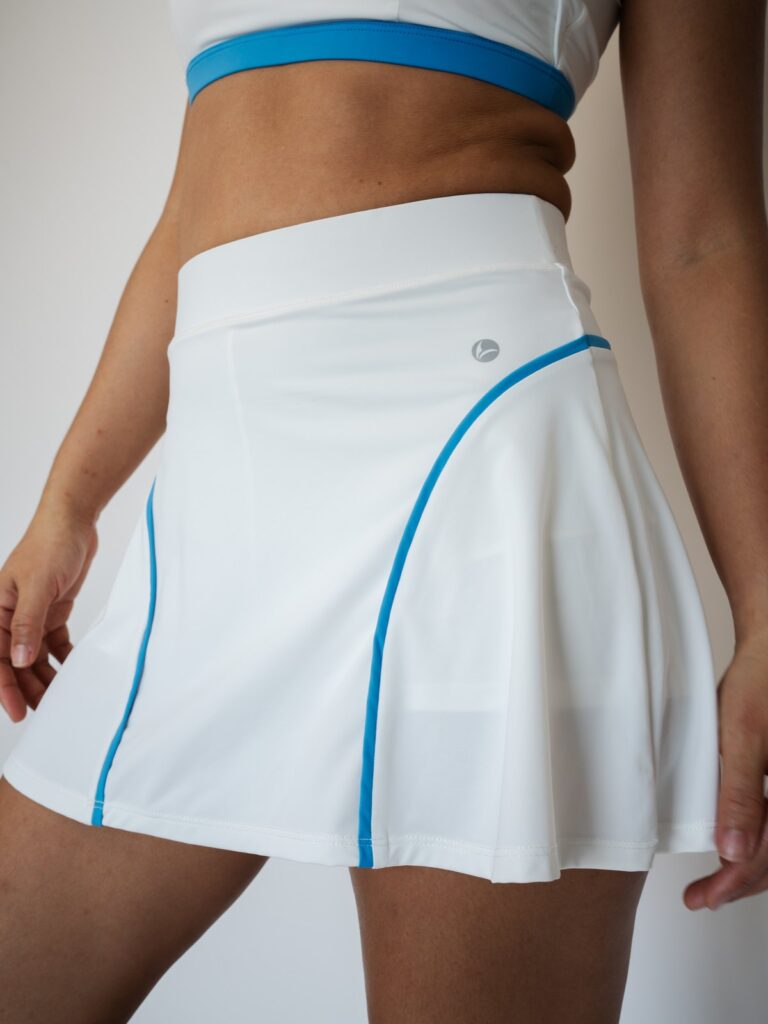 Close-up of the blue seam lines on the cream white Siena skort
