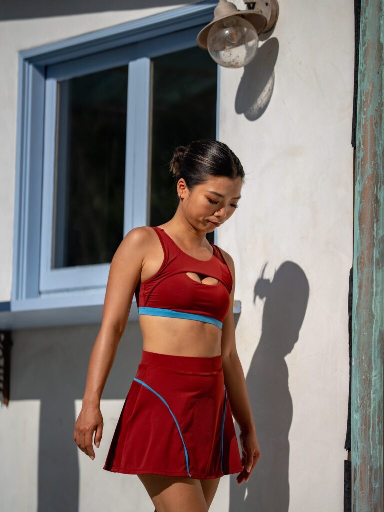 Woman by a white doorway in the Siena skort and top